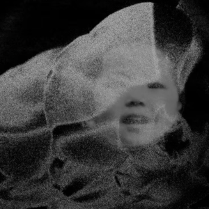 Experimental black-and-white image of an Asian child's face.